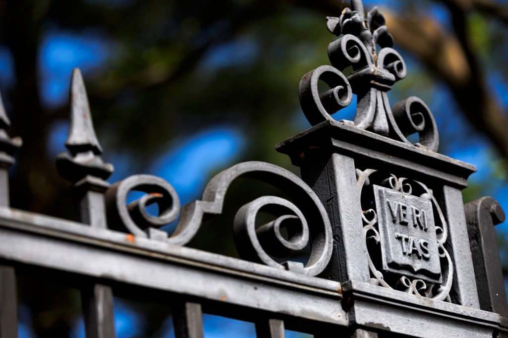 Veritas gate against blue skies.