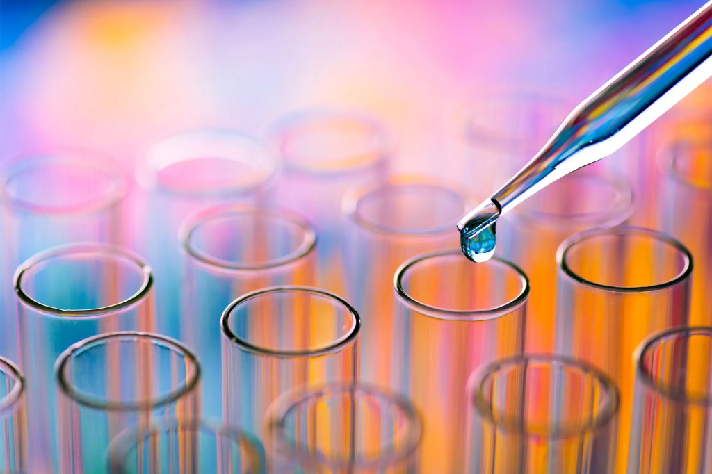 A dropper going into a test tube