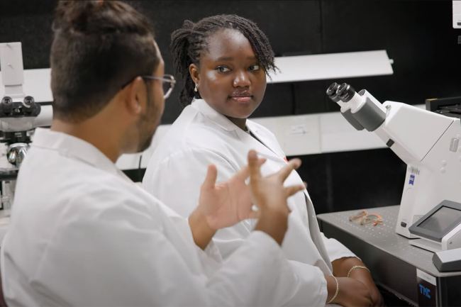 Du Bois Scholar in a lab with advisor