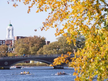 A bridge going over the Charles river with Harvard campus nearby