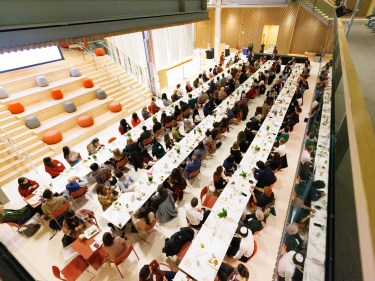Students sitting at tables in the Smith Campus Center