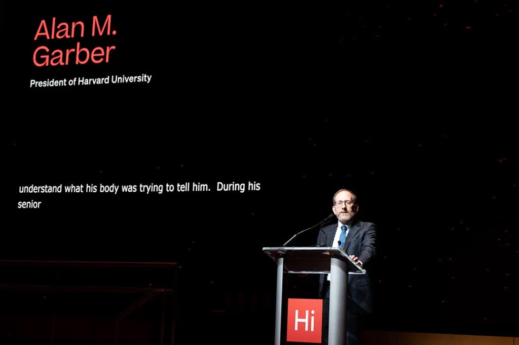 Alan Garber talking at a podium