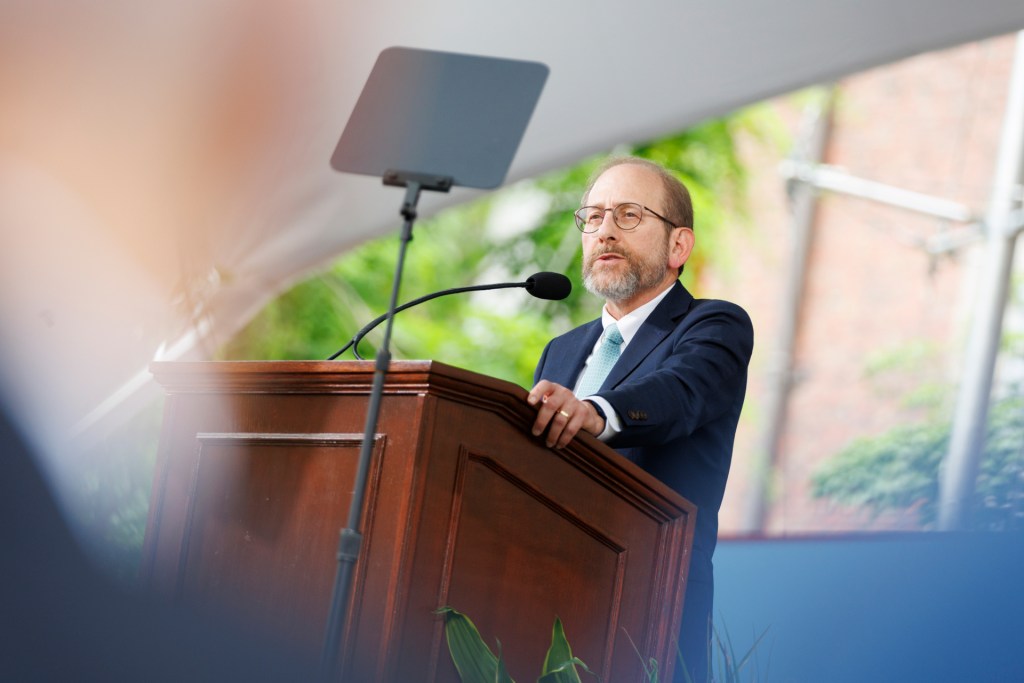 Alan Garber speaking at a podium