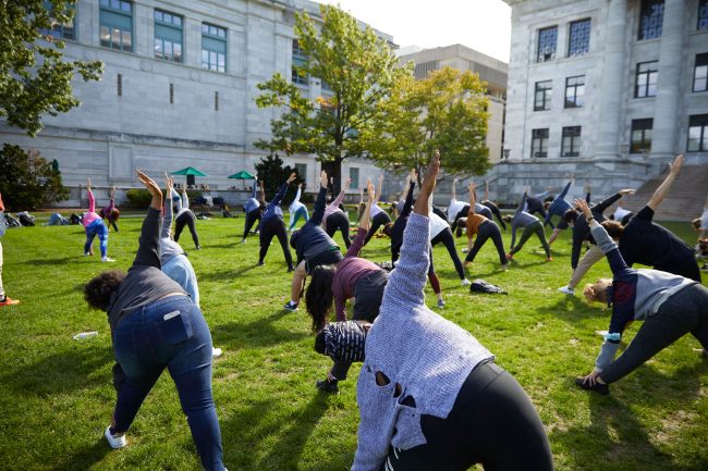 People doing yoga outside