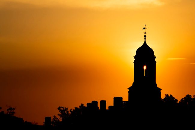 A tower against a red and orange sky