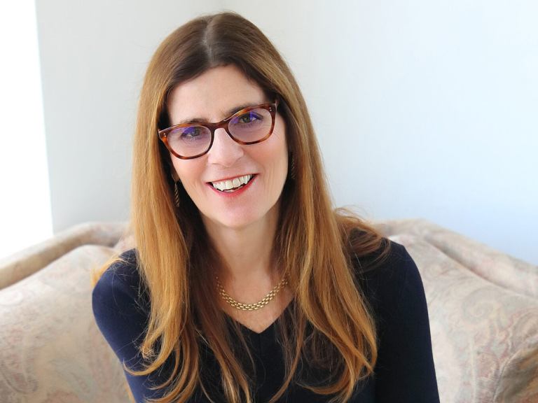 A professor smiling