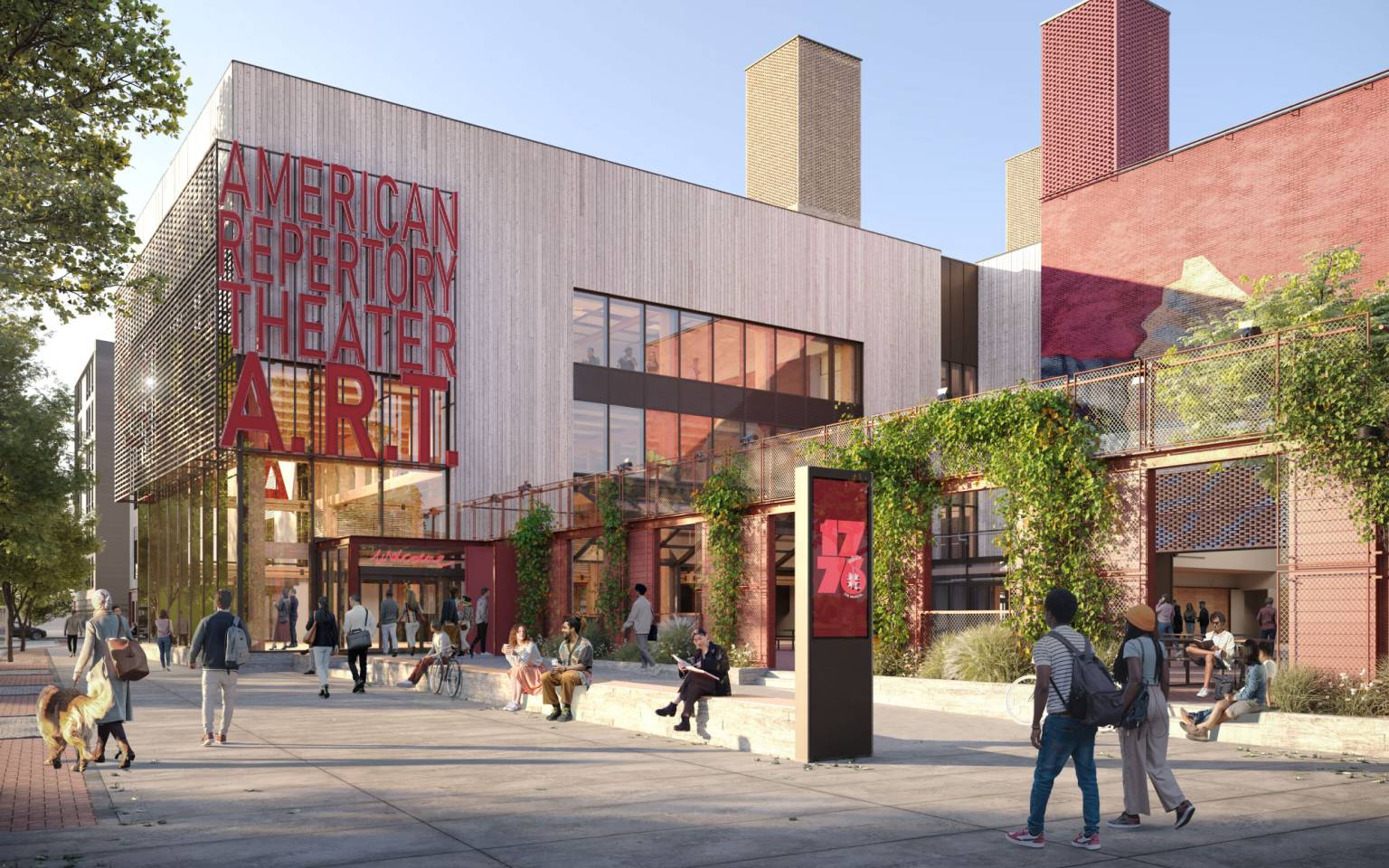 The exterior of the building during the daytime, with plants growing over the walls of the outdoor performance yard.