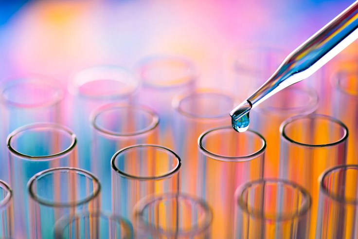 A dropper going into a test tube