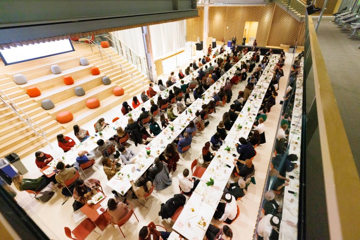 Students sitting at tables at the Smith Campus Center
