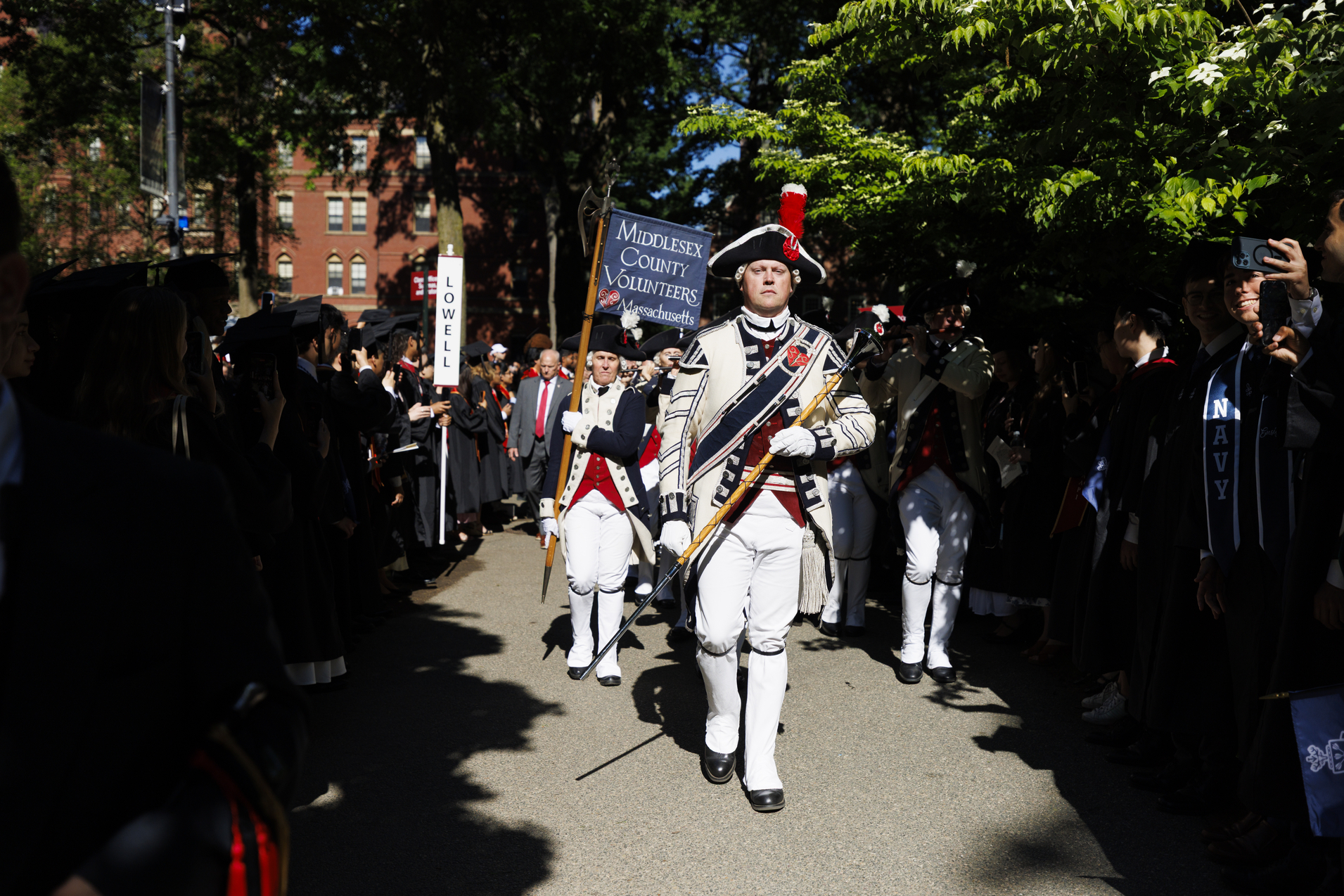 People in 1700s garb marching